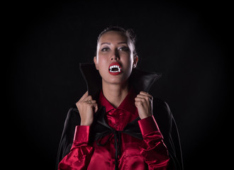 woman vampire, Dracula, studio portrait on a black background