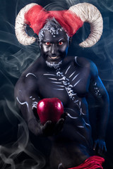 Fiery demon. A burning demon with horns and an apple of discord.