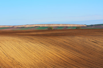 Farm land with plowed soil