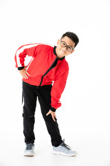 Naklejka premium Young and handsome young Asian boy in red and black cloths standing and looking at camera with smile face. Concept for exercise for good health kid.