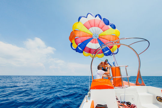 Parasailing water amusement - Stuff prepearing parachute to fly