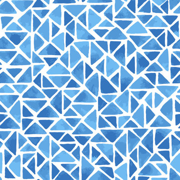 Hand painted mosaic background with triangles in blue. Seamless vector pattern