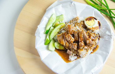Crispy pork with rice on wood plate,Food concept background.