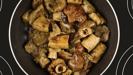 Cooking food concept. Cook fry the mushrooms in a frying pan.
