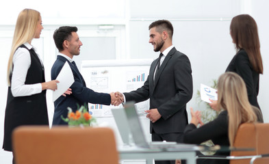 handshake business partners before a business presentation.