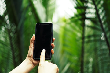 Woman hand using smartphone.