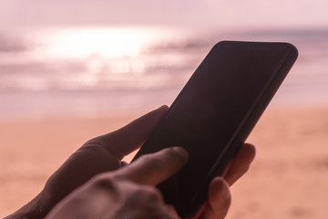 Woman hand using smartphone.
