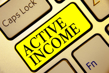 Text sign showing Active Income. Conceptual photo Royalties Salaries Pensions Financial Investments Tips Keyboard yellow key Intention create computer computing reflection document