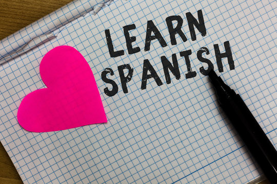 Text sign showing Learn Spanish. Conceptual photo Translation Language in Spain Vocabulary Dialect Speech Squared notebook paper ripped sheets Marker romantic ideas pink heart