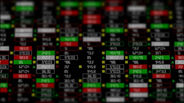 The camera slides horizontally. Focusing on the center of the screen. The world financial system. Growing and falling market. Broker board.