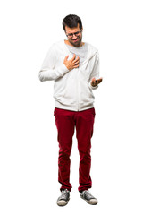 Full body of Man with glasses and listening music having a pain in the heart. Heart attack on white background