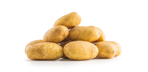 A pile washed potatoes isolated on white.