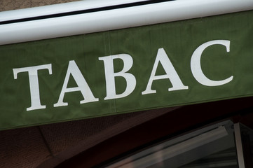 Obraz premium closeup of green tabacco store front with french text tabac, the traduction in english of tobacco