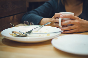 Obraz na płótnie Canvas girl at breakfast in a cafe