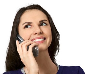 Friendly Young Woman Talking on Phone - Isolated