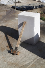 construction site on which the walls are built of gas concrete blocks and hammer