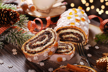 christmas poppy cake on wooden table