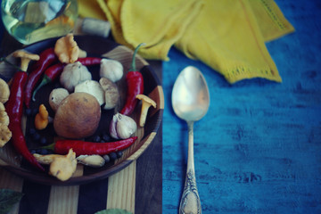 Forest picking mushrooms in wickered basket top view copy space/ table settings /Fresh raw mushrooms on the cutting board