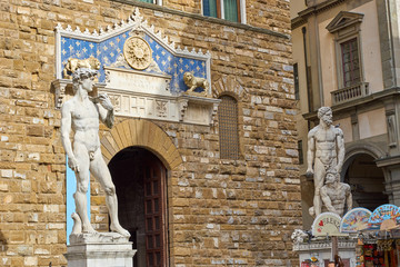 Obraz premium Entrance of Palazzo Vecchio with Michelangelos' David and Bandinellis' Hercules and Cacus in Florence in Italy