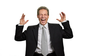 Portrait of ecstatic businessman with raised hands. Joyful middle-aged entrepreneur raised hands over white background. I was right.