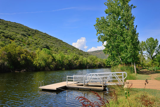 Floating platform in the Bullaque River of the natural setting of the Tables of the Yedra, Piedrabuena, Ciudad Real, Spain.