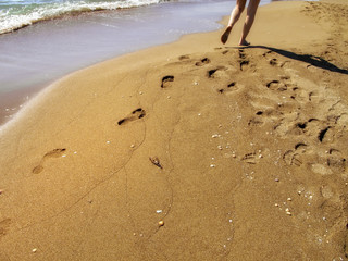 Fototapeta na wymiar relaxation vacation walk on sandy beach