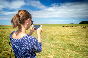 A woman girl taking photo phone
