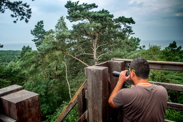 A man using binoculars 