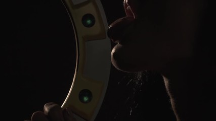 Sexually licks a blade of blade, an Amazon woman, close up shooting