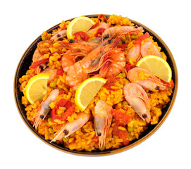 Bowl of fresh seafood paella with shell on prawns isolated on a background