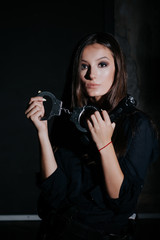 Police. Uniform. Sexy woman. woman is a policeman. Black background