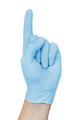 Hand in blue medical glove showing attention sign with forefinger up, isolated on white background