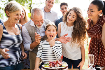 Family celebration or a garden party outside in the backyard.