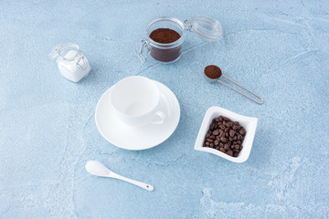 Obraz na płótnie Canvas Coffee Concept with Empty Coffee Cup, Sugar and Coffee