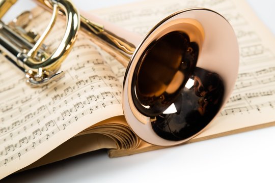 Trumpet On Music Notes Book Close-up