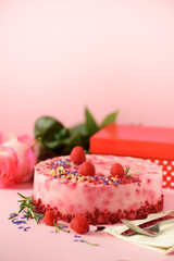 Gift boxes, roses, raspberry cake with fresh berries, rosemary and dry flowers on pink background. Banner, copy space. Valentine's Day concept. Present with love