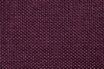 Purple background with braided checkered pattern, closeup. Texture of the weaving fabric, macro.