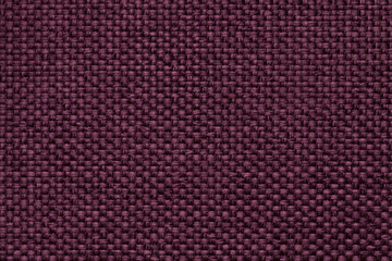 Purple background with braided checkered pattern, closeup. Texture of the weaving fabric, macro.