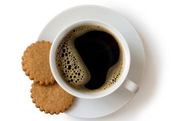 A cup of black coffee with two gingerbread biscuits isolated on white from above. White ceramic cup...