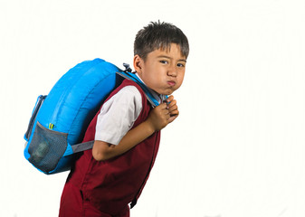  kid in uniform carrying bag full of books feeling upset and complaining about the weight of the...