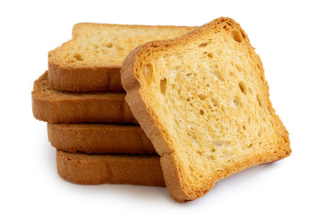A stack of plain melba toasts isolated on white.