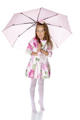 Little girl under an umbrella.