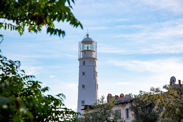 Lighthouse searchlight beam near ocean at day light Lighthouse in clear weather