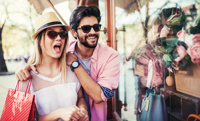 Shopping time. Young couple in shopping. Consumerism, love, dating, lifestyle concept