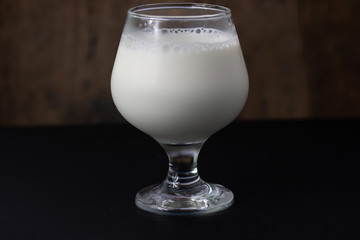 Fresh milk In a glass isolated on table background
