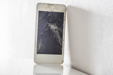 Cell phone with broken screen, closeup macro shot