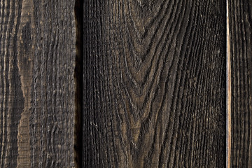 Fototapeta premium Close up of dark rustic wall made of old wood table planks texture. Rustic brown wood table texture background template for your design.