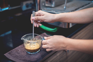 Barista preparing coffee for make iced coffee