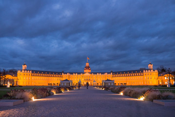 Fototapeta na wymiar illuminated castle in Karlsruhe, Germany at blue hour
