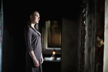 A girl with old books in the old house